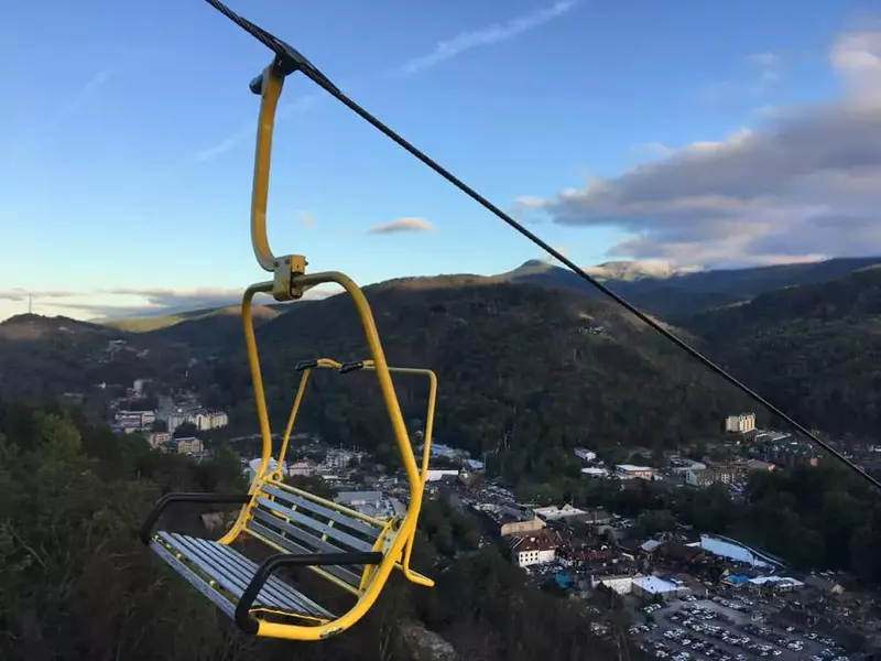 yellow chair going up the mountain at the gatlinburg skylift 