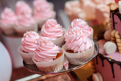 pink cupcakes in bakery on platter